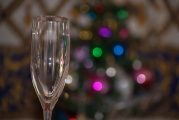glasses with defocused christmas tree in background