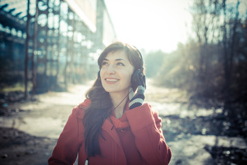 beautiful woman red coat listening music park