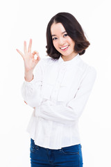 Cute woman with okay hand gesture