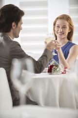 romantic couple toast with champagne at restaurant