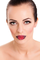 Woman's red lips coated with scattered sugar