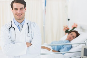 Smiling doctor with patient at hospital