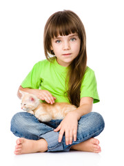 little girl stroking a kitten. isolated on white background