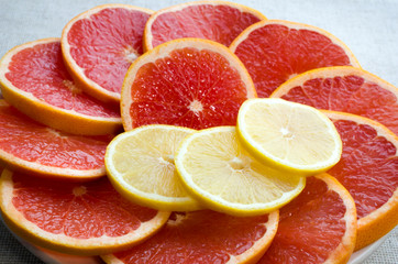 Fototapeta na wymiar sliced ​​lemons, grapefruit, oranges