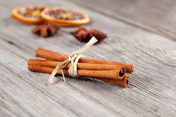 Cinnamon sticks, close up on wooden table