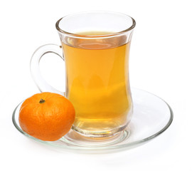 Cup of orange tea with orange