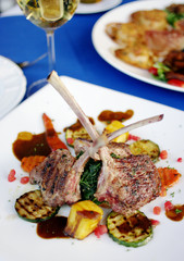 Lamb steak with sauce and boiled vegetables