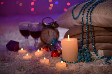 Composition with plaids, candles and Christmas decorations,