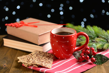 Composition of book with cup of coffee and Christmas