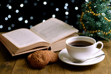 Composition of book with cup of coffee and Christmas