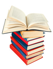 open book on top of stack of books