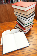 open books on wooden table