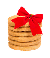 stack of honey cake decorated with red ribbon and bow knot