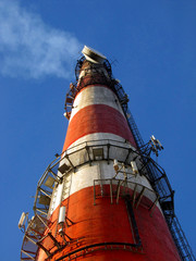 high red-white concrete industrial chimney