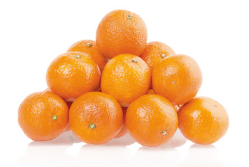 pile of tangerines on a white background