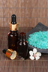 Spa composition with aroma oils on table close-up