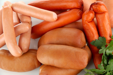 Various sausages isolated on white