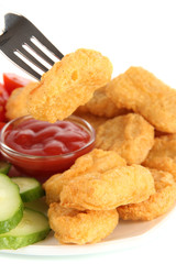 Fried chicken nuggets with sauce and vegetables isolated