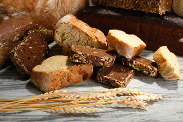 Much bread on wooden board