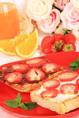 Obraz na płótnie Canvas Delicious toast with strawberry on plate close-up