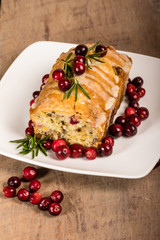 Cranberry walnut bread on a white plate