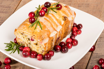 Cranberry walnut bread on a white plate