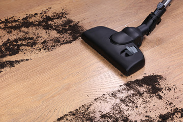 Vacuuming floor in house