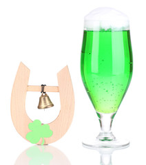 Glass of green beer and horseshoe for St Patricks day isolated