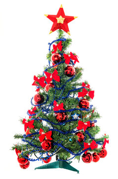 Christmas tree with baubles and star ornaments isolated on white