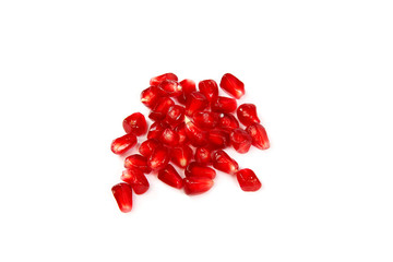 Pomegranate seeds on a white background.