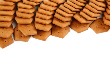 Stack of cracker biscuits on a white background.