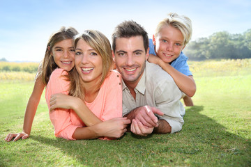 Portrait of happy family in summer time