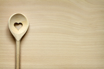Wooden kitchenware on cutting board abstract food background