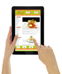Hands holding tablet with recipe website template isolated