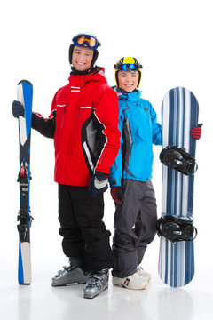 Happy smiling couple of snowboarder and ski rider