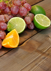 Fototapeta na wymiar grapes, limes, lemons and oranges