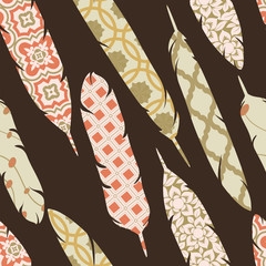 Vector seamless pattern with patch ornate colorful feathers