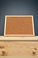Fototapeta premium Cork memory board on wooden cabinet