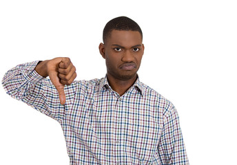 Unhappy young man giving thumbs down
