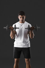 Naklejka na ściany i meble Athletic man lifting weights