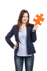 Business woman holding a puzzle piece