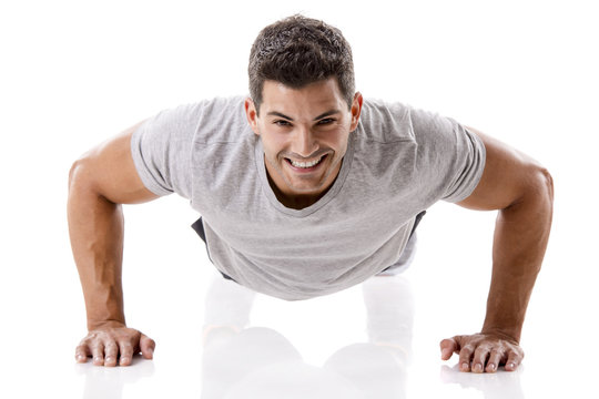 Handsome young man making pushups