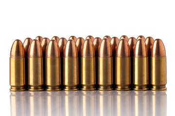 A group of 9mm bullets for a a gun isolated on white