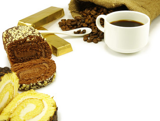 image of a cup of coffee, chocolate, rolls and coffee beans
