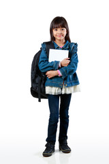 Little asian girl standing and holding books