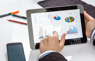 Businesswoman showing documents in digital tablet
