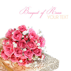 Bouquet of Pink Roses on Gold Gift Box isolated on white