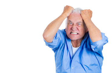 Stressed old man pulling out his hair, completely desperate