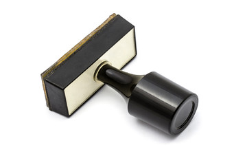 Black rubber stamper isolated on white background.
