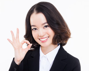 Young Asian business woman showing okay sign